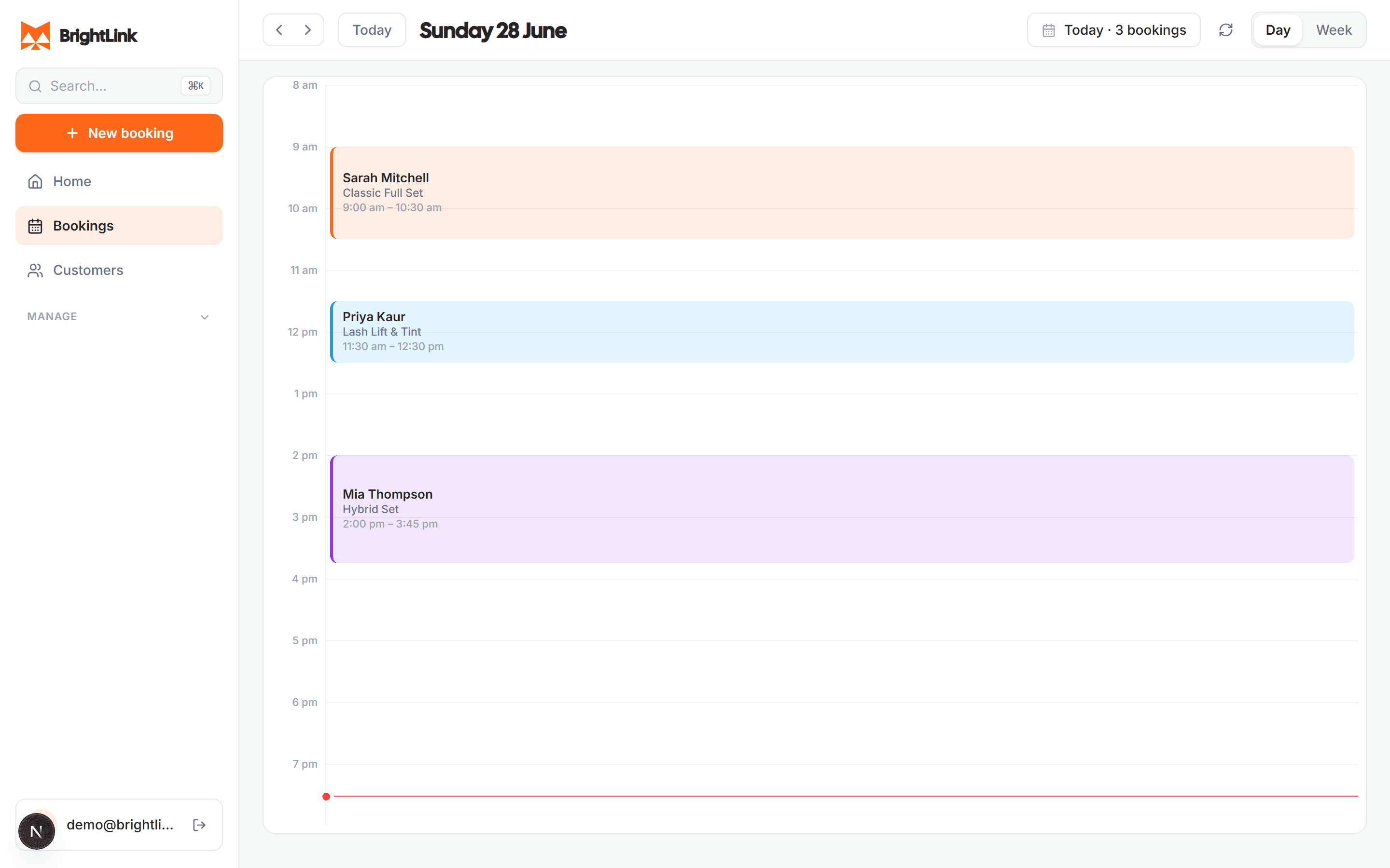 The BrightLink owner calendar on a laptop — the day's booked appointments